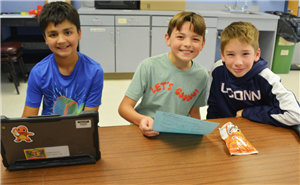 CREW After School Students working together and independently for homework time, enjoying a snack